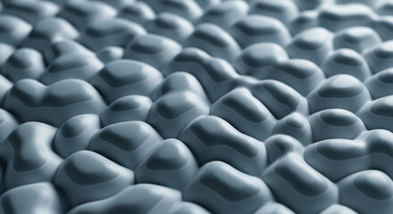 Obraz premium Close-up of a gray, textured surface with smooth, rounded bumps, creating an abstract, organic pattern ideal for background or design element