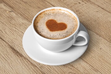 Ceramic white cup with coffee inside.