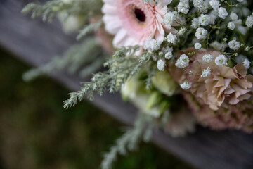 A Delicate Flower Bouquet Displaying Soft and Gentle Colors Alongside Lush Greenery