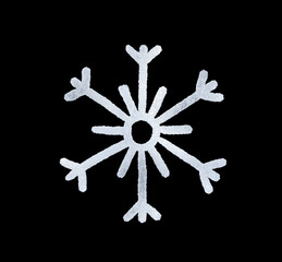 A snowflake painted by hand with silver metallic paint. A decorative snowflake made of silver foil..