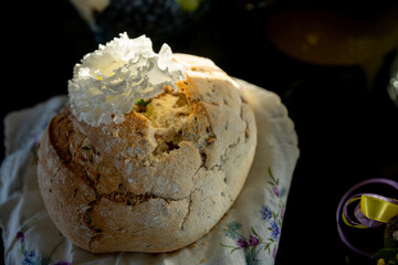 Delicious Artisan Bread Featuring an Exquisite Decorative Topping Resting on a Floral Napkin