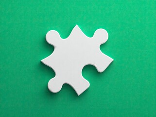 Single white puzzle piece on green