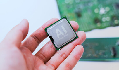 Hands positioning an AI processor on a green motherboard, symbolizing artificial intelligence hardware integration and development. Ai chip.