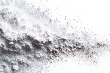 Close-up of white powder with brown specks.
