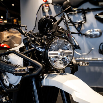 motorcycle Royal Enfield Himalayan 450 Kamet White classic on the parking lot logo detail