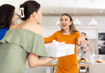 Fototapeta premium Cheerful girlfriends are happy to see each other at a bachelorette party or party