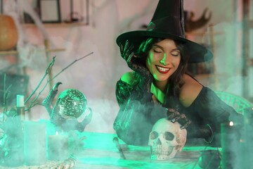 Young witch with skull at table