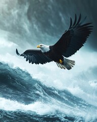 Obraz premium A majestic bald eagle soars above turbulent ocean waves, showcasing its powerful wings against a dramatic sky.