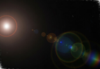 Bright lens flare effect with rainbow colors and bokeh circles