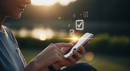Woman interacts with digital checklist on smartphone in park at sunset, highlighting productivity and technology integration in daily life.