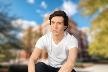 Fototapeta premium individual portrait of one happy young male standing outside