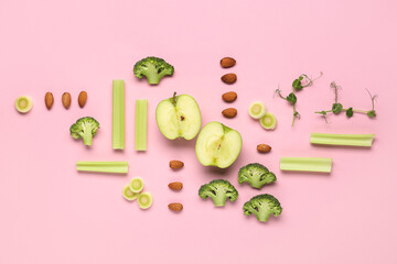 Composition with vegetables and fresh micro green on pink background, closeup