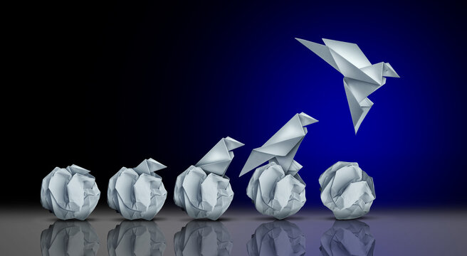 Starting a Business and Emerging Potential And Success as an unstoppable origami bird born rising from an egg representing business start up or development breakthrough and ambition.