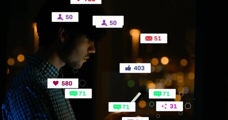 man tapping phone screen in dim apartment sending floating alerts showing social media engagement - Powered by Adobe