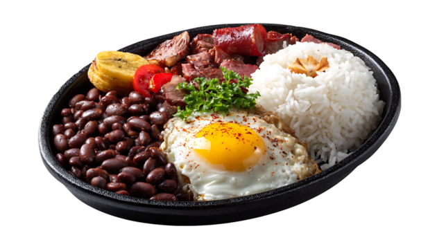 Colombian bandeja paisa with beans, rice, egg and meat, isolated on a white background
