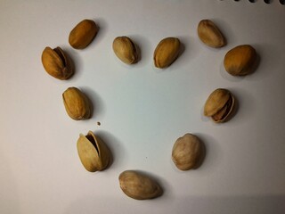 pistachio love shape white background 