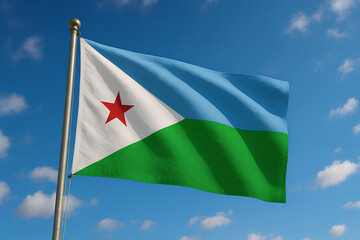 The Djibouti flag waves under a clear blue sky with soft clouds.