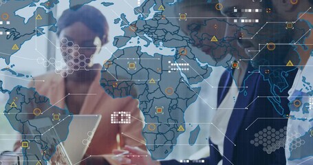 Colleagues leaning into laptop review as world map appearing showing data for business analysis - Powered by Adobe