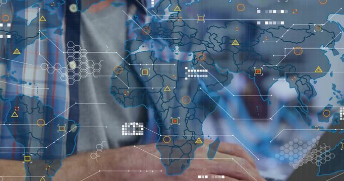 Developer typing on laptop in tech office, activating animated world map with live data nodes