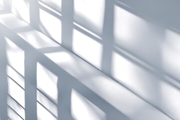 Obraz premium Shadows of a grid pattern on a white wall