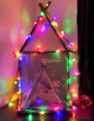 Enchanting Child's Play Tent Adorned with Colorful Fairy Lights