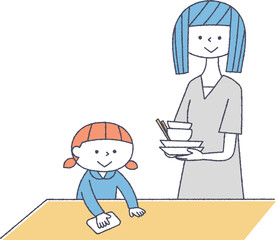 食後の片付けをする親子