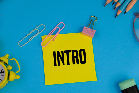 yellow sticky note with text of INTRO as an education and presentation concept on dark background.