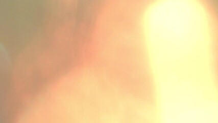 orange light leak lens flare burn film damage. - Powered by Adobe