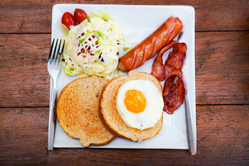 Breakfast Plate with Toast, Bacon, Egg, and Sausage