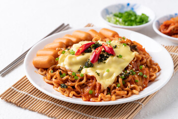 Korean spicy instant noodles with kimchi, sausage and Mozzarella cheese