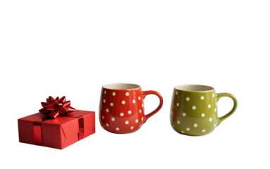 Red gift box with two polka dot mugs isolated on transparent background
