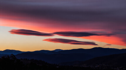 Sunset, beautiful rosy clouds, and the afterglow on the horizon
