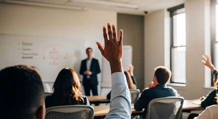A professional raising their hand in an interactive seminar, promoting collaboration and sharing ideas during a corporate training session or educational workshop.