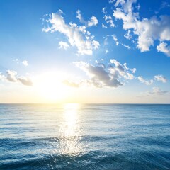 Obraz premium Sunrise over a placid ocean. Vast expanse of blue water meets a bright, cloud-filled sky