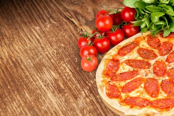 Tasty hot pizza dish with cheese on the desk