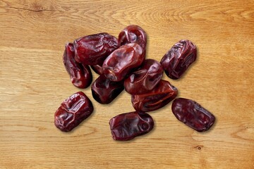 Dried date fruits on wooden desk