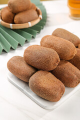 Fresh Guizhou Kiwifruit Set on White Plate - Healthy Organic Fruit Display