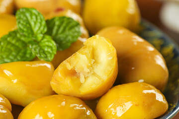 Fresh Raw Alpine Chestnuts with Mint Garnish in Bowl - Natural Organic Nuts Food Photography