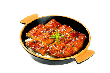 Japanese Kabayaki Eel with Teriyaki Glaze Over White Rice in Cast Iron Pan on White Background