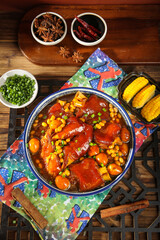 Delicious pork trotter stew with golden corn and soybeans, traditional Asian comfort food with secret spices