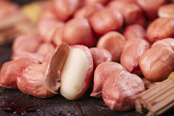 Fresh Raw Peanuts with Red Skins One Cracked Open Showing White Kernel Natural Organic Legumes