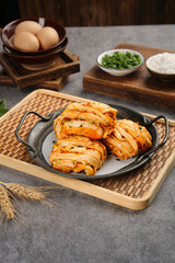 Handmade Steamed Meat Buns with Scallions on Bamboo Serving Tray - Traditional Asian Cuisine