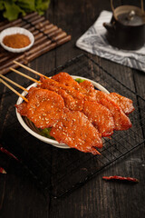 Grilled Meat Skewers with Sesame Seeds on Bamboo Sticks - Asian BBQ Barbecue Food