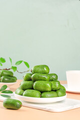 Fresh Green Dates with Soft Light Background and Natural Botanical Elements