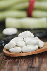 Fresh White Kidney Bean Legumes on Wooden Spoon with Corn Background Farm Picked Healthy Food Ingredient