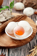 Fresh Farm-Raised Duck Eggs with Orange Yolks on Rustic Wooden Board - Natural Organic Poultry Products