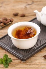 Healthy Herbal Tea Cup with Mint Leaves and Teapot on Wooden Table for Wellness and Relaxation