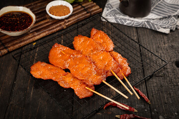 Grilled Pork Tenderloin Skewers on Cooling Rack with Spices and Dipping Sauces