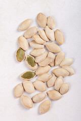 Raw Pumpkin Seeds with Thin Shells on White Background - Healthy Cooking Ingredient