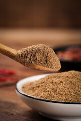 Ground Spices and Seasonings in Wooden Spoon for Cooking and Barbecue Marinades